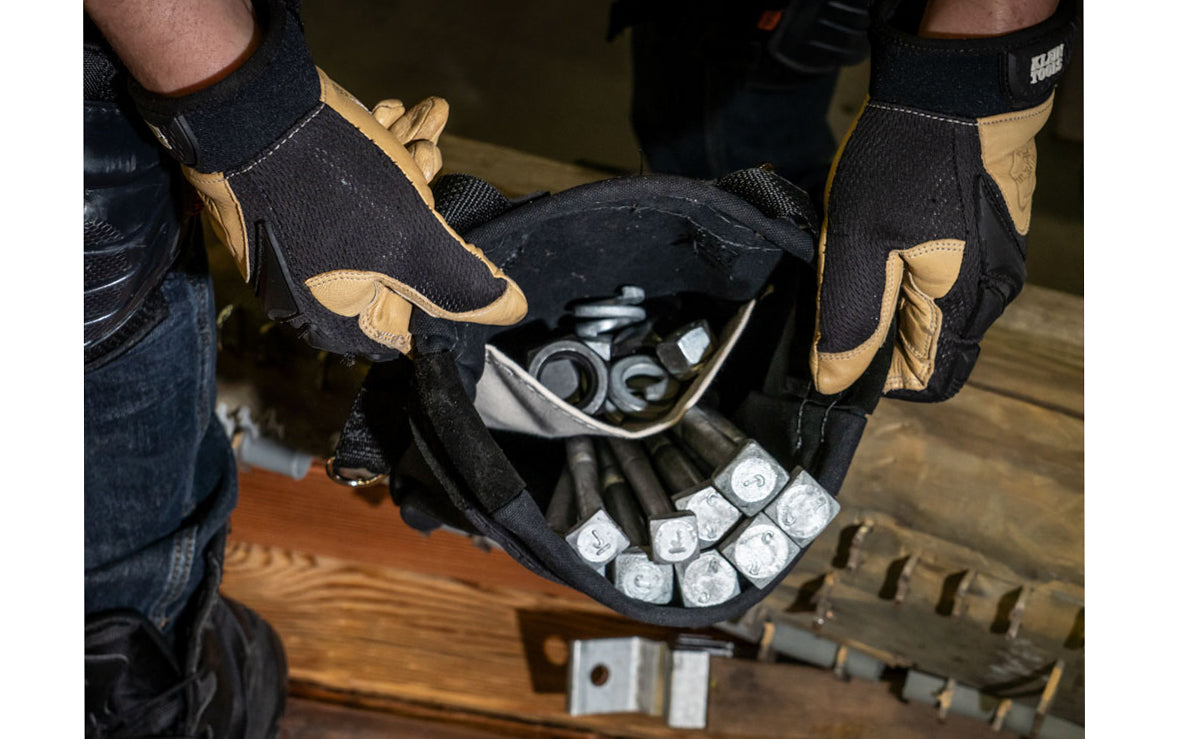 Klein Tools' Nut & Bolt Pouch is reinforced with leather & rope, which also keeps the shape of the pouch opening. This tool bag has an interior pocket, & metal snaps on the loops for belts up to 3" wide. Overall size measures 9" x 3.5" x 10". Klein Model 51A. Made in USA.