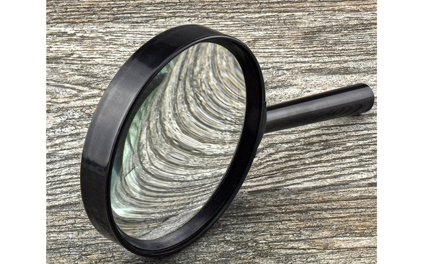 3-1/2" Handheld Magnifier - 2.25x Magnification. This magnifier offers 2.25X magnification with a 4.25 diopter, featuring a scratch-resistant glass lens with a diameter of 3.5 inches. 3-1/2" diameter lens.