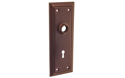 Brass Escutcheon Door Plate with Keyhole ~ Oil Rubbed Bronze Finish ~ Vintage-style Hardware · Classic & traditional design ~ Quality stamped brass material ~ 6-7/8" high x 2-1/2" wide ~ For solid or pre-bored (2-1/8") hole doors