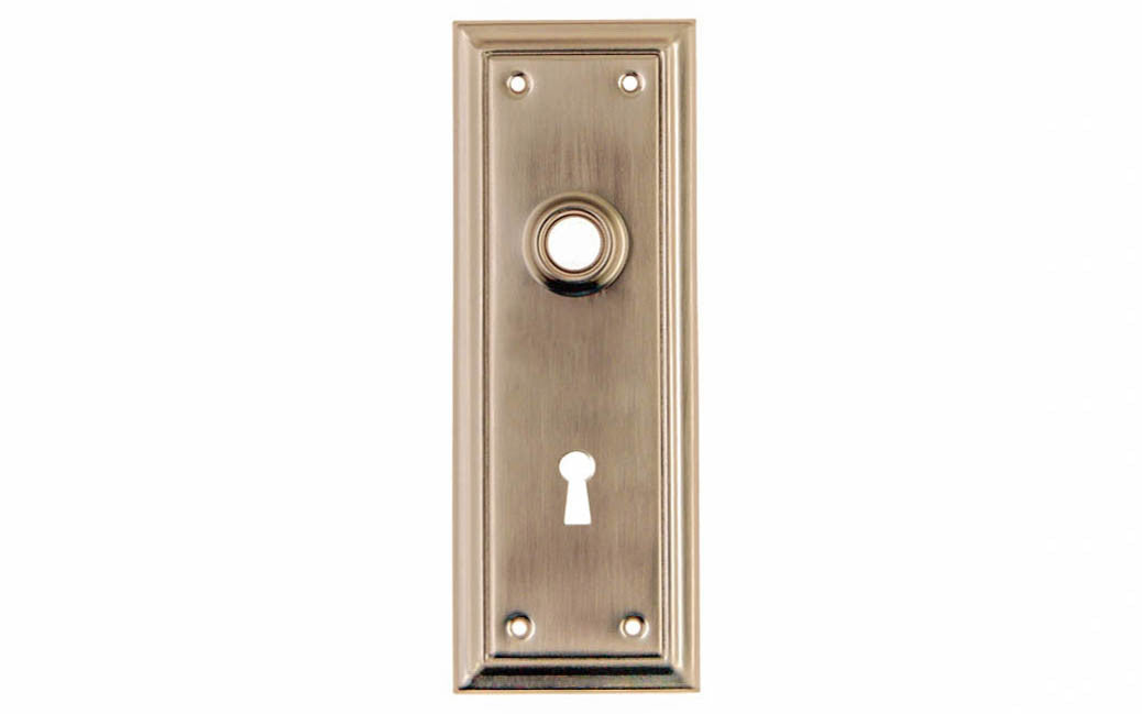 Brass Escutcheon Door Plate with Keyhole ~ Brushed Nickel Finish ~ Vintage-style Hardware · Classic & traditional design ~ Quality stamped brass material ~ 6-7/8" high x 2-1/2" wide ~ For solid or pre-bored (2-1/8") hole doors