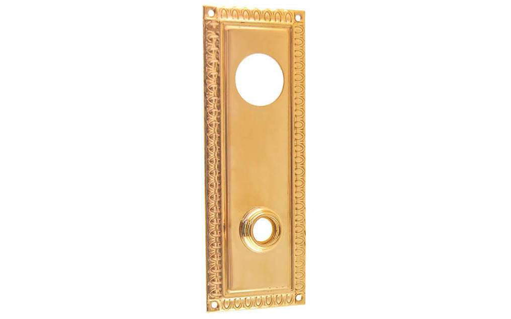 Brass Escutcheon Keyway Cylinder Door Plate ~ Lacquered Brass Finish ~ Vintage-style Hardware · Decorative beaded design ~ Quality stamped brass material ~ 7" high x 2-1/2" wide ~ For solid or pre-bored (2-1/8") hole doors