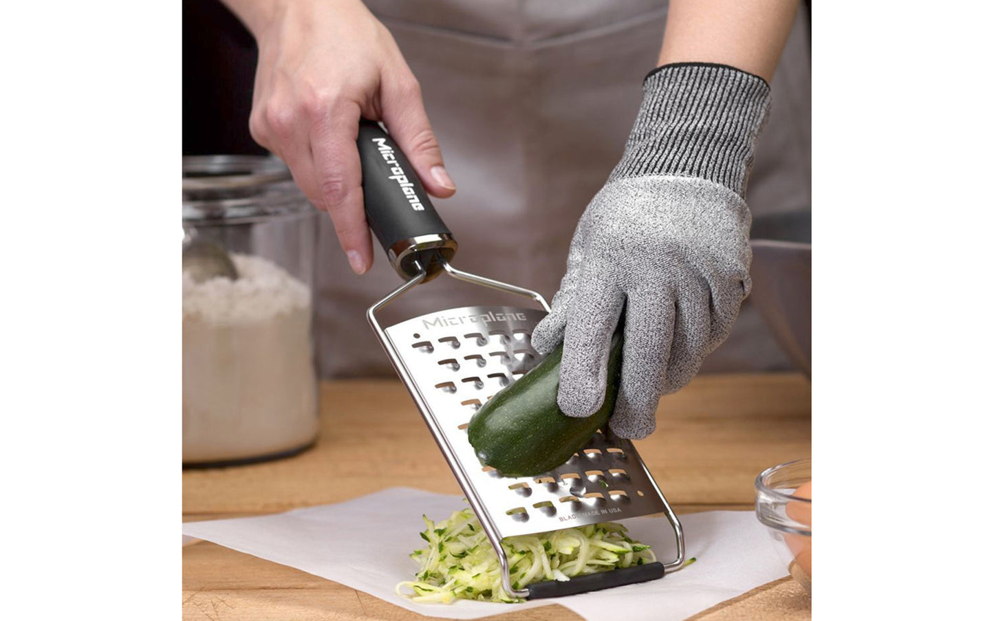 Microplane Cut Resistant glove - Model 34007 - Protects fingers & knuckles from grater blades - Medium and Large Size Glove - Fits both Right & Left hands - Easy to clean: Machine washable, drip dry - MED Size - LG Size - Protects hand from sharp Microplane tools - FDA compliant - Cut proof glove - Safety glove