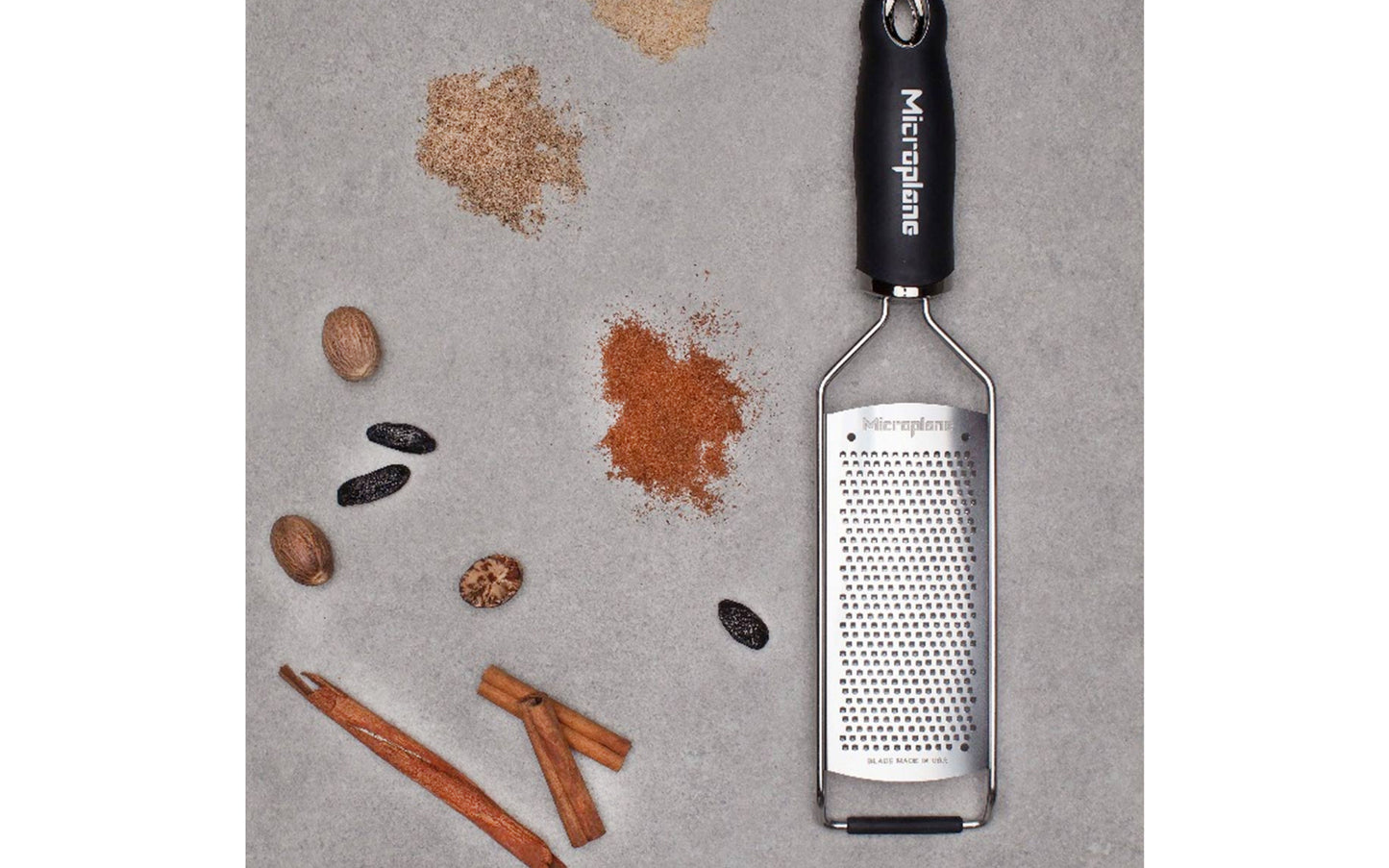 Made in USA - Blade made in USA - Great for grating hard cheese, citrus zest, spices, chilies, garlic, cinnamon, ginger, onions - Non-slip grip - Dishwasher safe - Razor-sharp blades made from stainless steel - 18/8 grade - Ergonomic handle ~ No-slip base - Microplane Gourmet Series - Gourmet Fine Grater - Model 45004 - 098399450049