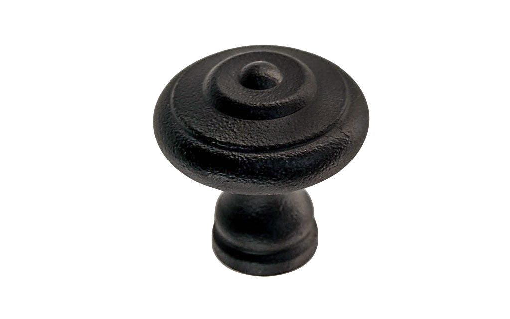 Satin Black Mid-Century Style Cast Iron Knob. Designed in the Mid-Century Style of hardware, but the knob will fit with any time period up to the current modern styles. Made of cast iron material. The knob works well in kitchens, bathrooms, on furniture, cabinets, drawer. 1-3/16" diameter size knob.