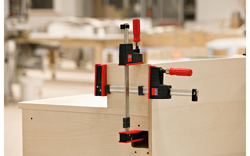 Bessey Parallel K-Body REVO JR Bar Clamps have 90 degree jaws that make cabinet work, frame ups, drawers & any other right-angle glue-up a much easier task. 18" max opening - 3-1/4" throat depth - Model KRJR-18 - Bessey K Body REVO JR - The large surface areas distribute high clamping force evenly - Wooden Handles - 091162001417