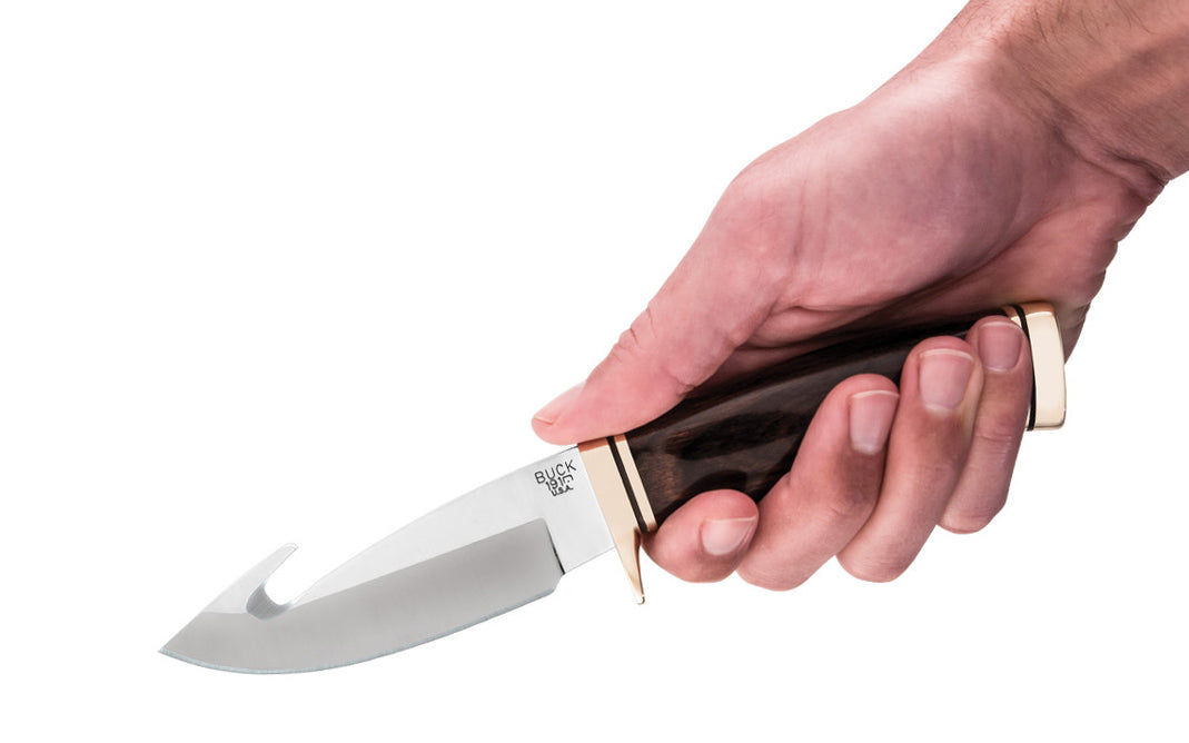 Buck Knives Zipper Knife & Sheath - Fixed Blade with Walnut Dymalux Handle - Model No. 0191BRG-B ~ Made in USA ~ Made in Idaho ~ Blade made of 420HC Stainless Steel - Satin finish ~ 4-1/8" long blade ~ Blade made of 420HC Stainless Steel - Satin finish ~ Fixed blade - Full tang ~ Brass bolsters & guard ~ Handsome Walnut Dymalux Handle ~ Includes a genuine brown leather sheath