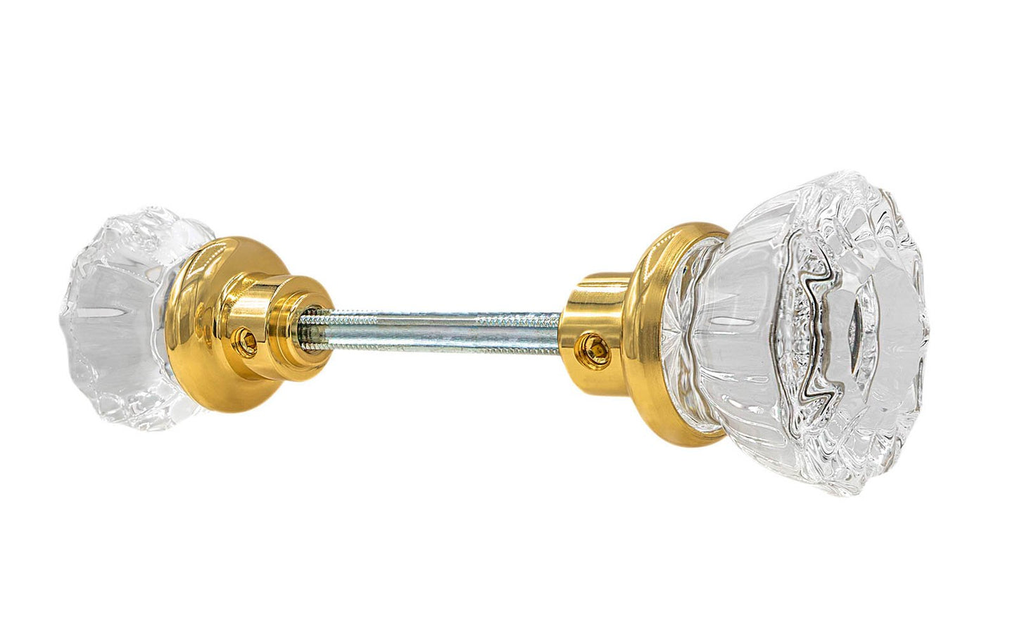 Pair of Classic Fluted Clear Glass Doorknobs with spindle. A high quality & genuine glass doorknob set with an attractive fluted design. The sparkling center point under glass amplifies reflected light to showcase beautiful facets. Solid brass base. Reproduction Glass Door Knobs. Traditional Fluted Glass Knobs. Lacquered Brass Finish.