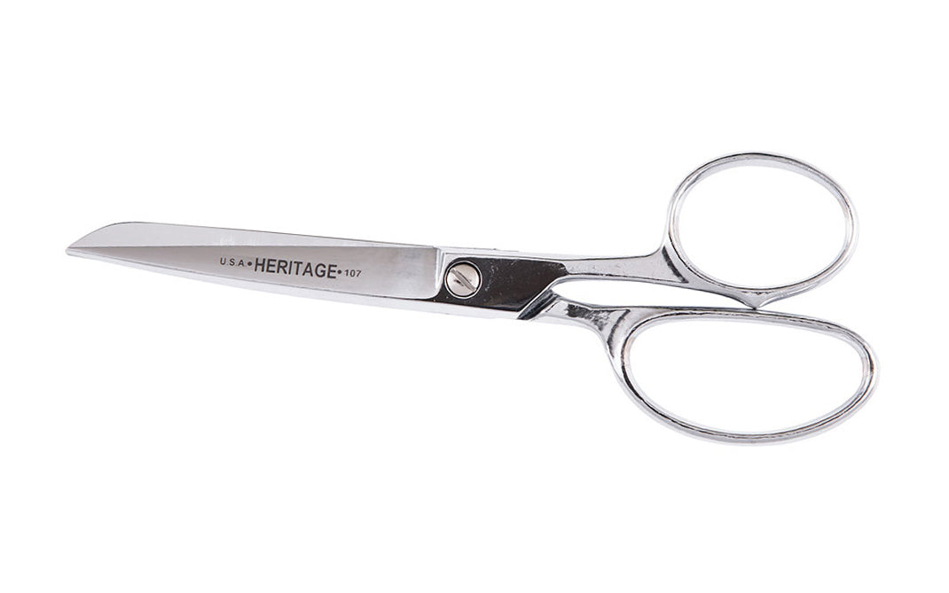 Heritage 7" Straight Trimmer Chrome-Plated Scissors. Hot forged cutlery. Precision ground scissor blades produce a sharp clean, uniform cut. Cutlery grade steel ensures blades stay sharp. Chrome over nickel-plated blades resists corrosion & rust. Cuts textiles, cardboard, plastics. Model 107-P. Trimmer made in USA.