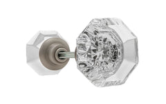 A high quality & genuine glass doorknob set with an attractive octagonal design. The sparkling center point under the glass amplifies reflected light to showcase beautiful facets. The rim of the brass base folds over the base of the glass knob for a secure grip. Brushed Nickel Finish