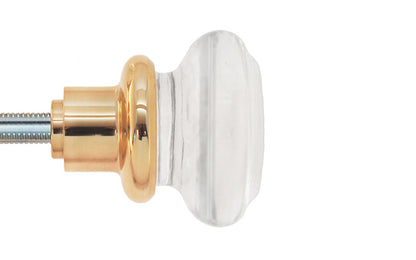 Pair of Classic Round Clear Glass Doorknobs with spindle. A high quality & genuine glass doorknob set with an attractive round design. The sparkling center point under glass amplifies reflected light to showcase beautiful facets. Solid brass base. Reproduction Glass Door Knobs. Traditional Round Glass Knobs. Unlacquered Brass (Will Patina Over Time). Non-Lacquered Brass.