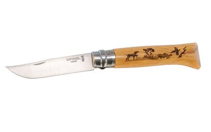 Made in France · Opinel Stainless Steel No. 8 Knife ~ "Dog" Handle. 3-1/4" long foldable stainless blade with stainless locking collar ~ Beechwood handle with specially engraved dog motif. Opinel Inox knife.