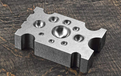 2-1/2" x 4" Steel Dapping Block. This steel dapping block is ideal for use by hobbyists, jewelers, and craftsmen for shaping metals & other materials in jewelry making, metalworking, & other applications. & 2-1/2" x 4" x 1" size.