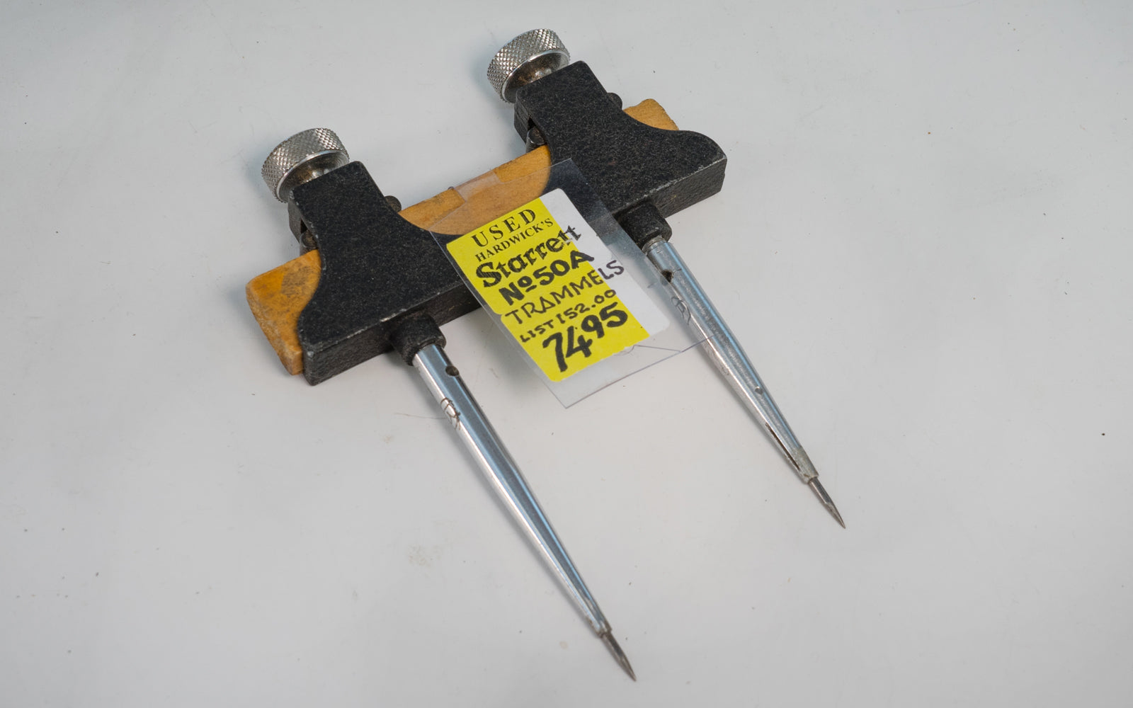 Starrett 50A Trammels - USED. Heads are die cast with black wrinkle finish & have hardened, forged steel divider points. The points screw into the heads. Model 50A. Used - Good condition - Initials of previous owner engraved on points. Made in USA.