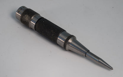 Starrett 18C Automatic Center Punch - USED. The Starrett Automatic Center Punch with Adjustable Stroke features a lightweight, knurled steel handle for a positive grip & easy handling. 130mm (5 1/4") Length, 17mm (11/16") Diameter, Heavy Duty.   Made in USA.