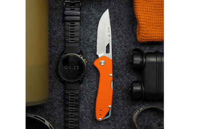 Buck Knives 724 Mustang Folding Knife - Orange color. Model 0724ORS-B. 3-1/4" long blade. Modern EDC knife. Made in USA.