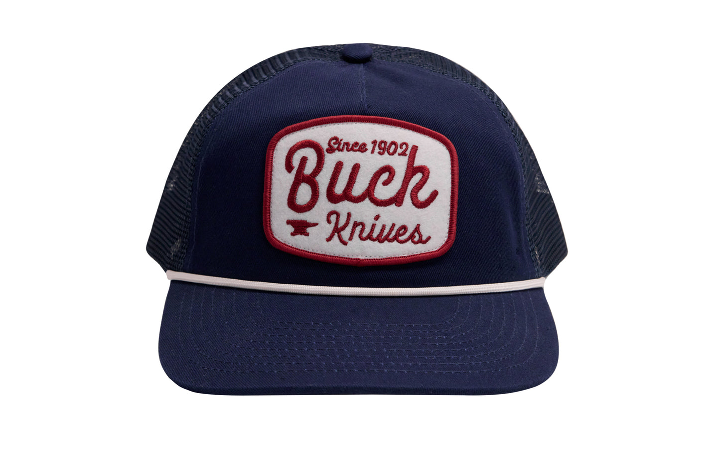 Buck Knives Five-panel snapback trucker hat in navy with white and red rounded Buck Knives felt patch and white rope. Low-profile with pre-curved bill. Navy twill and navy mesh. Snapback closure, adjustable fit. One size fits most. Buck Knives Ball Cap Hat.