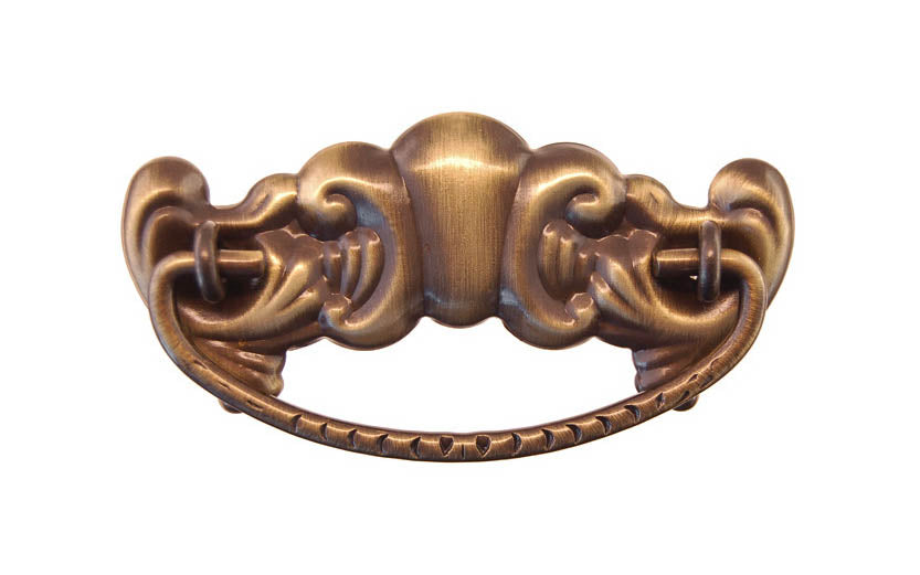 Brass Victorian Drop Pull ~ 3" On Centers - Antique Brass Finish ~ Vintage-style Hardware · Traditional & classic ~ Made of high quality solid brass material ~ 3" spacing of screw holes ~ Includes an ornate stamped brass backplate ~ Designed in a traditional Victorian style, but suitable for different traditional & period decors ~ Ornate style