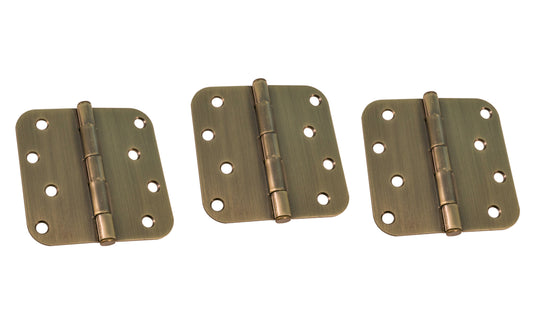 Three 4" Antique Brass Door Hinges with 5/8" radius corners & a removable pin. Antique Brass finish on steel material. Countersunk holes. Includes flat head screws. 4" x 4" door hinge size. Five knuckle, full mortise design. Ultra Hardware No. 61753. 3 hinges.