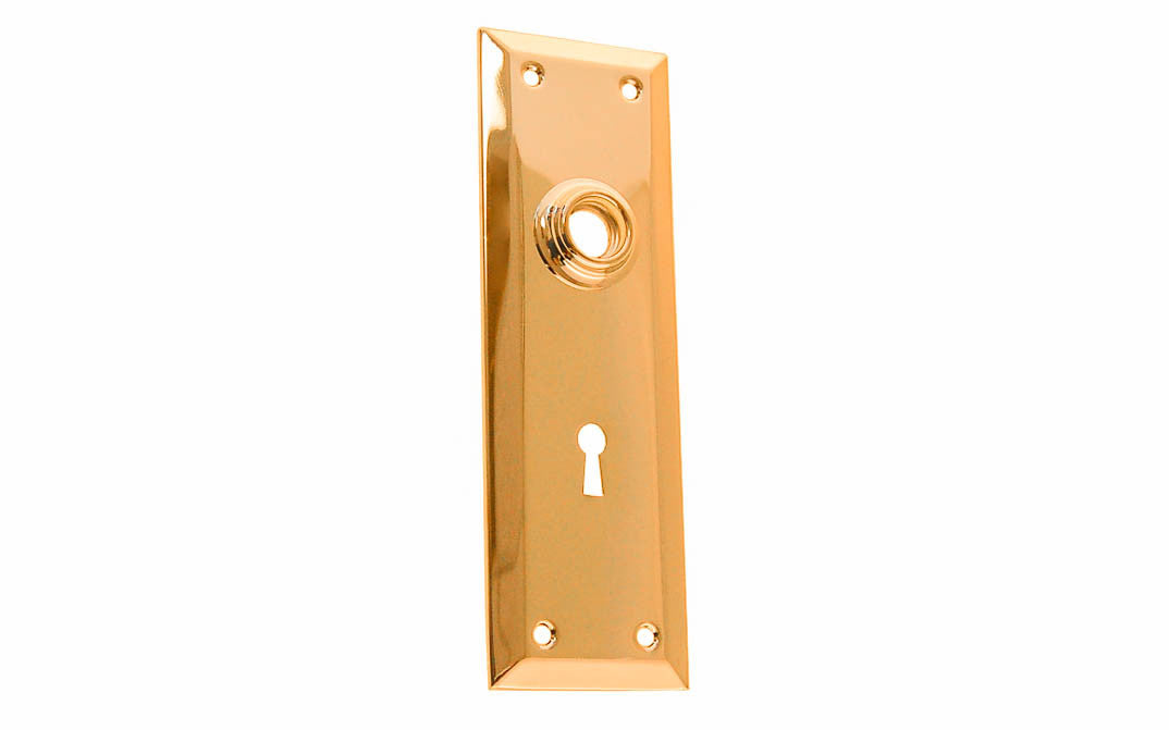 Brass Escutcheon Door Plate with Keyhole ~ Non-Lacquered Brass (will patina naturally over time) ` A classic & handsome door escutcheon plate with a keyhole. Made of quality stamped brass material, this escutcheon plate is a well-made & durable piece of hardware. The plate may be used on modern doors with 2-1/8" pre-bored holes, or with the old-style mortise lock sets on traditional doors as well. 