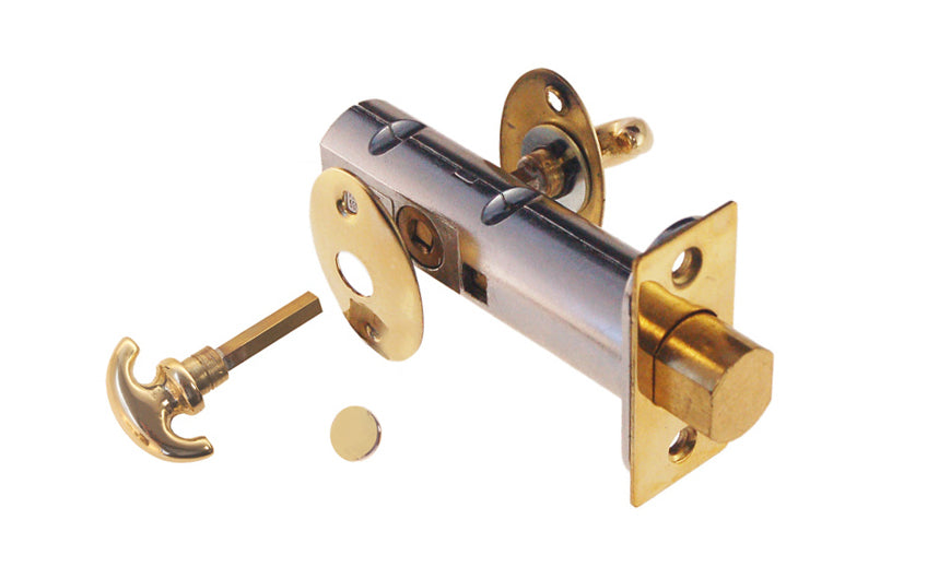 Traditional-style thumbturn deadbolt latch for doors. On the backside it has a special emergency slot for unlocking the door, plus a small rosette plate with an optional plug to cover up the hole - Non-Lacquered Brass (will patina over time)