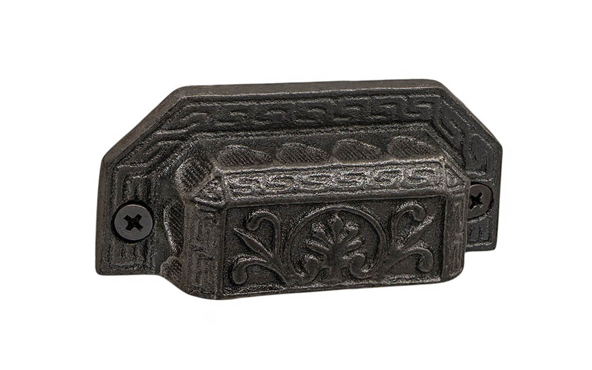 Rustic-looking & ornate cast iron bin pull with a very nice & charming ornate detail. Made of cast iron material, the bin pull is thick with a good grip. This Victorian style bin pull is originally from 19th century time period. Vintage finish with lacquer to resist rust. Cast Iron Ornate-Style Bin Pull ~ 3" on Centers