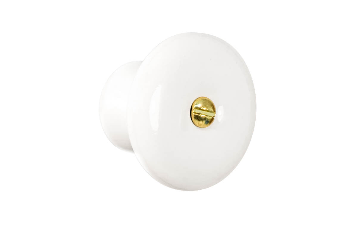 A classic & traditional white porcelain round cabinet knob. Made of quality porcelain, this stylish knob has a smooth & attractive look & feel. Works well in kitchens, bathrooms, on furniture, cabinets, drawers. White Porcelain Knob with Brass Screw Bolt. 1-1/2