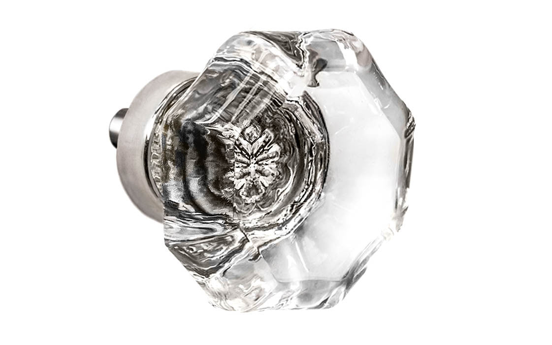 Elegant & classic octagonal cabinet glass knob with attractive genuine clear glass. The glass is carefully set into a handsome solid brass base with a threaded shank in the back. Polished nickel finish on solid brass base. Octagon shape knob. 1-1/2