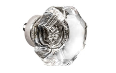 Elegant & classic octagonal cabinet glass knob with attractive genuine clear glass. The glass is carefully set into a handsome solid brass base with a threaded shank in the back. Polished nickel finish on solid brass base. Octagon shape knob. 1-1/2" Diameter Knob 