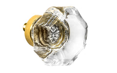Elegant & classic octagonal cabinet glass knob with attractive genuine clear glass. The glass is carefully set into a handsome solid brass base with a threaded shank in the back. Unlacquered brass base - Will patina naturally over time. Octagon shape knob. 1-1/2" Diameter Knob 