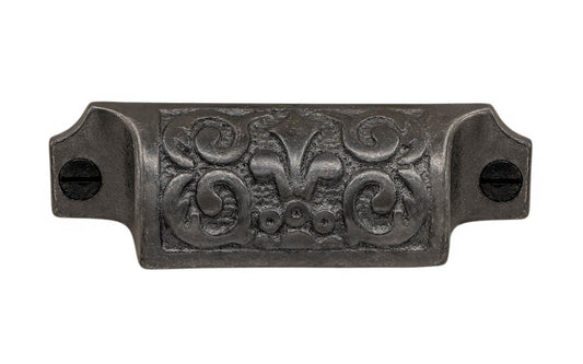 Rustic-looking & ornate cast iron bin pull with nice & charming "Fleur-de-Lis" detail. Made of cast iron material, this pull is thick with a good grip. This old-style bin pull is great for adding charm to your cabinets & drawers. Vintage-style finish with lacquer to resist rust. Victorian style pull. 3-1/4" on centers