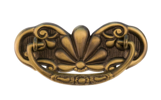 A traditional & ornate 3" on centers drop pull that's great for dressers, drawers, cabinets, tables, desks. Made of quality solid cast brass material, this drop pull is very durable with a nice look. Antique Brass Finish.