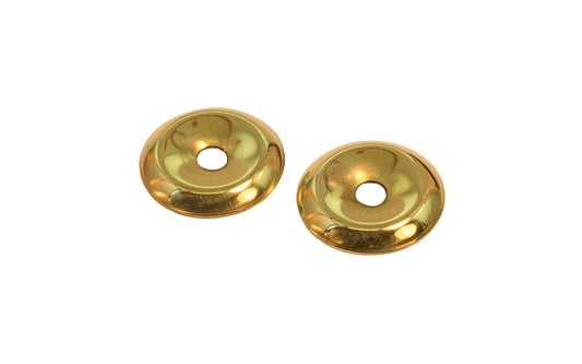 A stamped brass 7/8" diameter backplate with a small cup in the center. These finishing washers serve as back plates for knobs, bail sets etc. Sold as one pair.