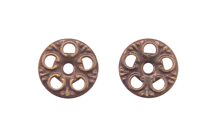 An ornate stamped brass 1-1/16" diameter backplate. These ornate pierced rosette backplates serve as back plates for knobs, bail pulls, etc. Sold as one pair. Antique brass finish.