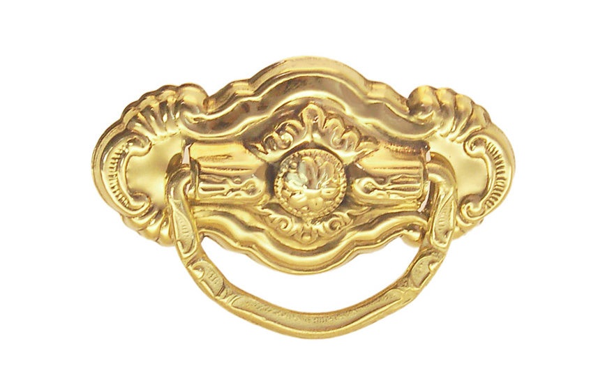 Vintage-style Traditional Hardware · Stamped brass drop pull in the Colonial Revival style. Made of stamped brass material with a nice detailed design of a "flower" at its center. Timeline: Early 20th Century, Colonial Revival, Depression Era, Waterfall style. Unlacquered brass. Non-lacquered brass