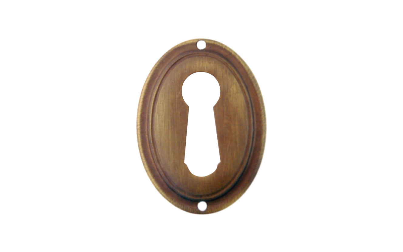 Vintage-style Hardware · An attractive & stylish Stamped Brass Vertical Oval Keyhole piece made of quality stamped brass material with a nice trim. This keyhole will certainly add character & style to your cabinets, drawers, & furniture. Traditional & classic. Antique brass finish