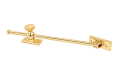 Vintage-style Classic & Premium Solid Brass Casement Adjuster Stay ~ 12" Length. For securing outswing casement windows. It has a durable pivot turn with a knurled knob for smooth & secure operation. Unlacquered brass. Non-lacquered brass (the un-lacquered brass will patina over time).