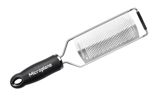 Made in USA - Blade made in USA - Great for grating hard cheese, citrus zest, spices, chilies, garlic, cinnamon, ginger, onions - Non-slip grip - Dishwasher safe - Razor-sharp blades made from stainless steel - 18/8 grade - Ergonomic handle ~ No-slip base - Microplane Gourmet Series - Gourmet Fine Grater - Model 45004 - 098399450049