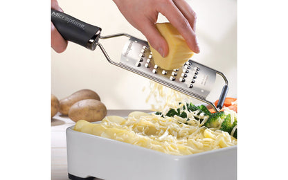 Made in USA - Blade made in USA - Great for grating soft cheese, carrots, potato, zucchini, cabbage - Non-slip grip - Dishwasher safe - Razor-sharp blades made from stainless steel - 18/8 grade - Ergonomically designed handle ~ No-slip base - Gourmet Series Extra Coarse Grater - 098399450087 - non-skid foot - 45008