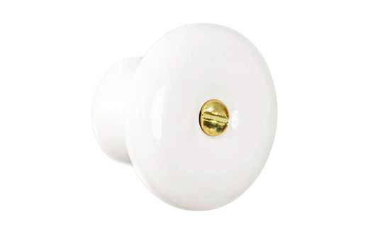 Vintage-style Hardware · Traditional & classic White Porcelain Knob with Brass Screw.  Made of high quality genuine porcelain, this stylish knob has a smooth & attractive look & feel. The knob works well in kitchens, bathrooms, on furniture, cabinets, shutters, drawers, etc. White Porcelain Knob with Brass Bolt. 1-5/8" Diameter Knob