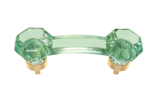 Elegant & classic octagonal cabinet glass pull with an attractive "Depression Green" color. The pull handle has 3" on centers. The glass is carefully set into a handsome solid brass bases with threaded shanks in the back. Octagon Glass pull. 3" center to center. Unlacquered solid brass base.