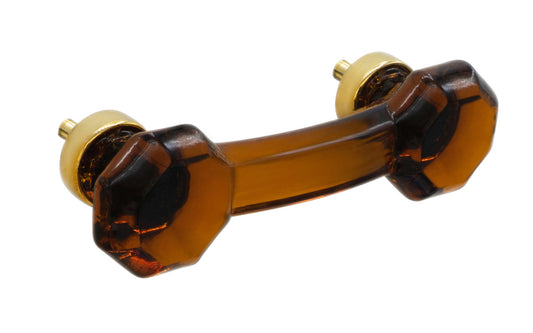 Elegant & classic octagonal cabinet glass pull with an attractive "Amber" color. The pull handle has 3" on centers. The glass is carefully set into a handsome solid brass bases with threaded shanks in the back. Octagon Glass pull. 3" center to center. Unlacquered solid brass bases.