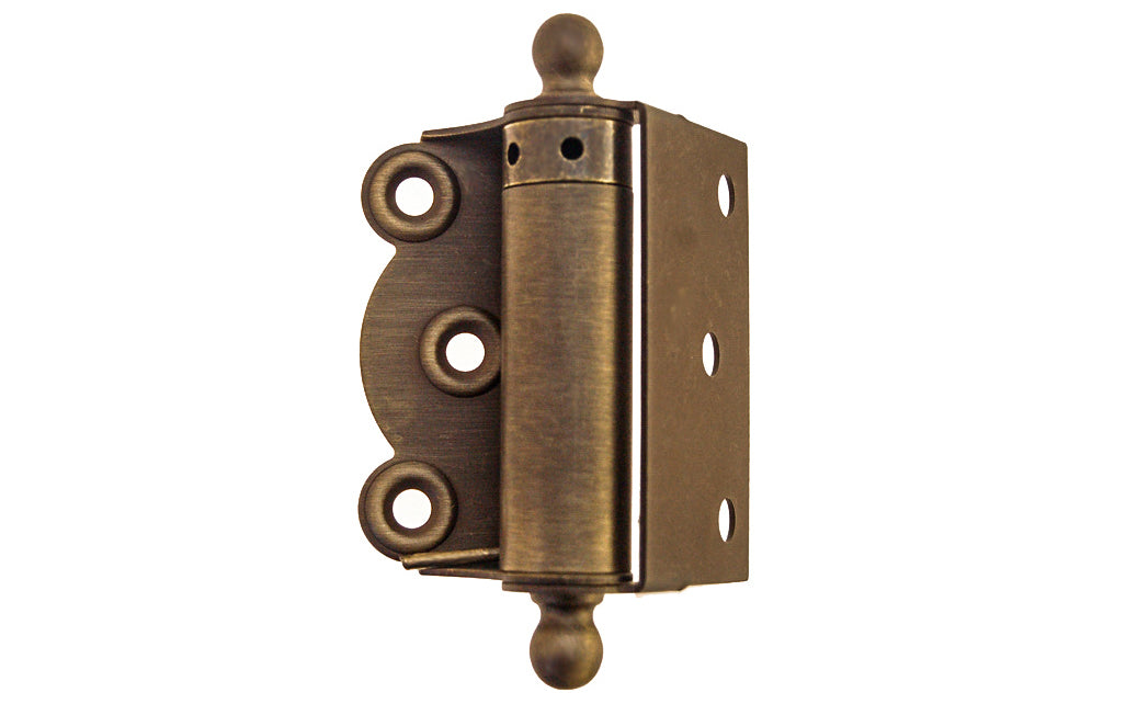 Traditional half surface brass spring hinge with solid brass ball-tips with a concealed spring. Designed for screen doors & other light duty self-closing doors. 2-3/4" high hinge size. Solid Brass Ball Tip Screen Door Hinge. Antique Brass Finish.