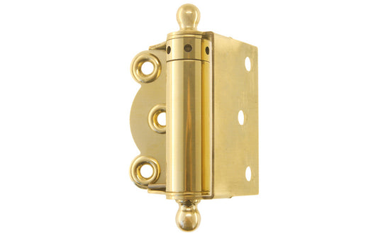 Traditional half surface brass spring hinge with solid brass ball-tips with a concealed spring. Designed for screen doors & other light duty self-closing doors. 2-3/4" high hinge size. Solid Brass Ball Tip Screen Door Hinge. Unlacquered Brass (will patina over time). Non-lacquered brass. Un-lacquered Brass.