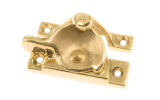 High quality classic solid brass crescent-style sash lock with square corners designed for hung or sash windows. Solid brass material with a durable pivot turn. 2-1/2" x 1" Size Lock. Unlacquered Brass (will patina over time). Un-lacquered brass. Non-lacquered brass.