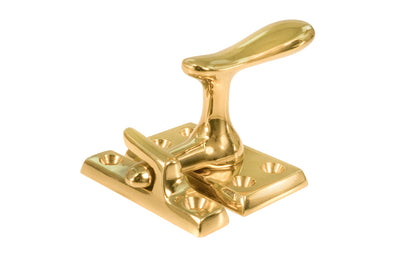 Classic & Traditional Solid Brass Casement Window Latch ~ Large Size. 2" high x 1-1/8" wide latch turn base. Locks & tightens window frames or small doors. Reversible for right or left applications. Vintage-style casement window lock. Unlacquered Brass (will patina over time). Non-lacquered brass. Un-lacqeured brass.