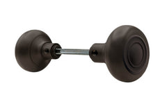 Pair of Traditional & Classic Brass Circle-Ring Design Doorknobs with spindle. Quality hollow core wrought brass doorknobs with an attractive circle-ring design. Reproduction Brass Door Knobs. Traditional Brass Knobs with Spindle. Set includes two knobs with spindle. Oil Rubbed Bronze Finish.