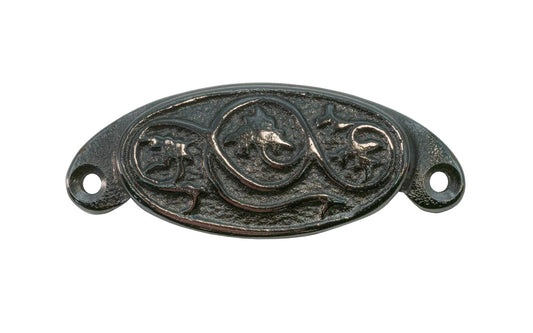 A rustic-looking & ornate cast iron bin pull with a nice & charming floral "Ivy" detail. Made of cast iron material, this bin pull is thick & stout with a good grip. This bin pull time-period dates from 19th century, & is great for adding charm to your cabinets & drawers. Vintage finish with lacquer to resist rust.