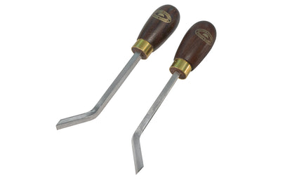 A pair of two "dog leg" chisels made by Crown Tools. These bent corner chisels are the ideal tools for cleaning corners, grooves & mouldings, these tools also enable access to positions where normal chisels cannot work. Bent left & right hand with Rosewood handles. 1/4" (6 mm) size. Model 175RC.