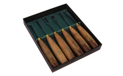 This Crown Tools 6-Piece woodcarving set is a great beginners set. High quality hardened & tempered Carbon steel with Beech handles. Made in Sheffield, England. Features 5/16" (8mm) Chisel, 5/16" (8mm) Bent Chisel, 5/16" (8mm) Skew Chisel, 3/16" (5mm) Straight Gouge, 5/16" (8mm) Bent Gouge & 3/16" (5mm) Bent V tool. Model 220