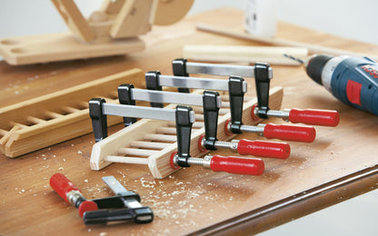 Bessey Clamps ~ Model No. LM2.012 - Light weight, & made of quality durable material, Bessey Light-Duty Steel Bar Clamps heads are made of tough die cast zinc, & black powder coated to prevent corrosion. Plastic pressure cap protect  work piece surface. 330 lbs. Clamping force - Excellent for woodworking - 12" Long - 091162013038